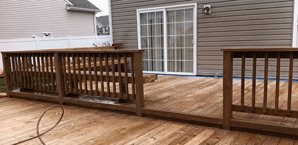 Deck sealing service protecting a backyard wood deck and railings in Chula Vista, CA