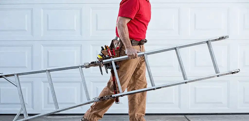 Garage door repair technician arriving with tools and ladder in Chula Vista, CA