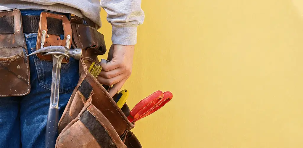 Handyman with tool belt ready for home repairs and maintenance in Chula Vista, CA