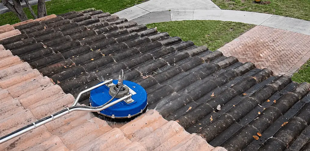 Roof pressure cleaning removing debris and buildup from roof tiles in Chula Vista, CA