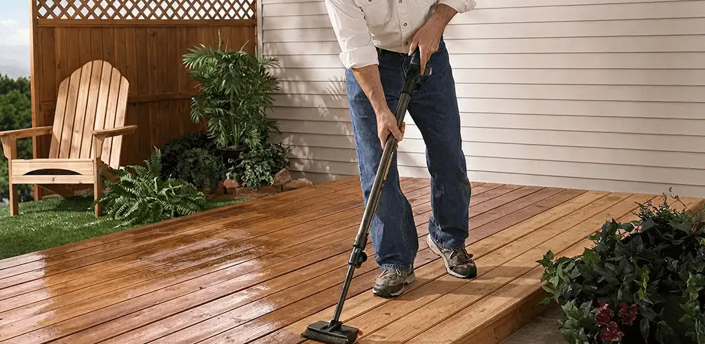 Deck staining service applying stain to a backyard wood deck in Chula Vista, CA